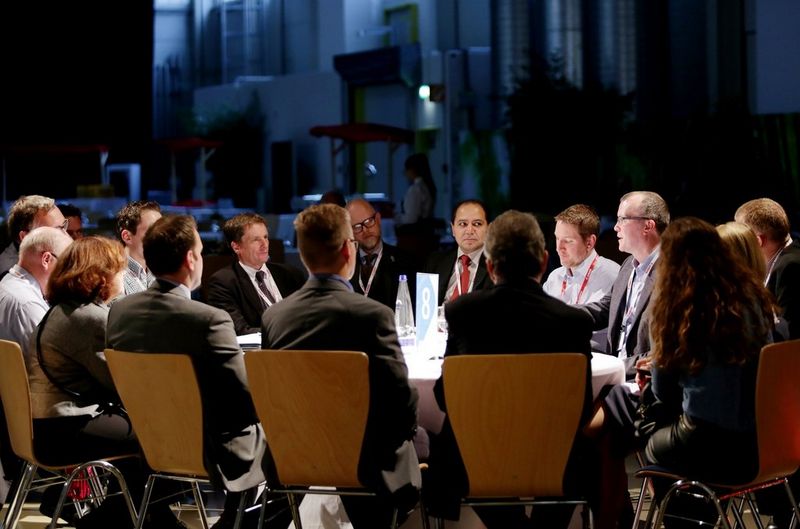 Business meeting in conference room behind glass wall